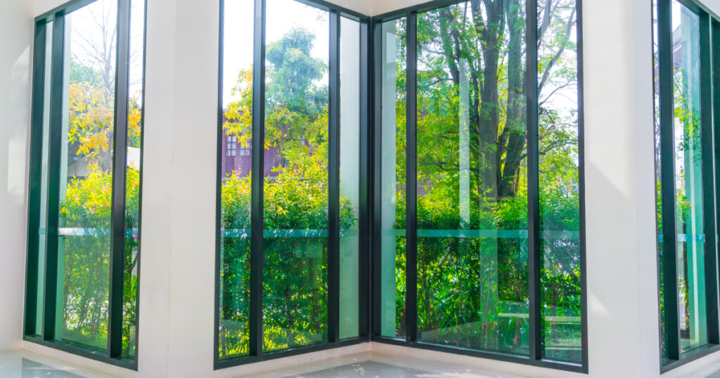 glass window overlooking green garden 1